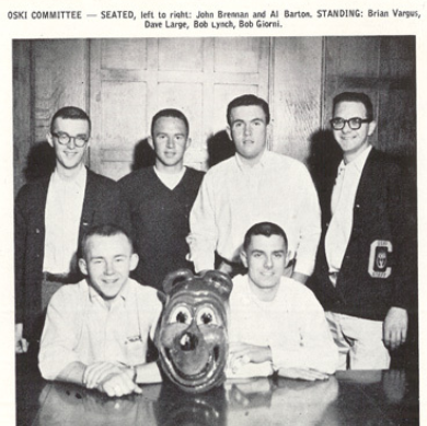 Archival scan: The Oski committee posing around the mascot head. Photo credit: Photographer/artist uncredited in supplied scan.