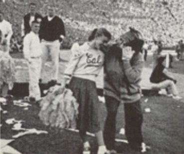 Archival scan: Oski posing beside a Cal cheerleader. Photo credit: Photographer/artist uncredited in supplied scan.