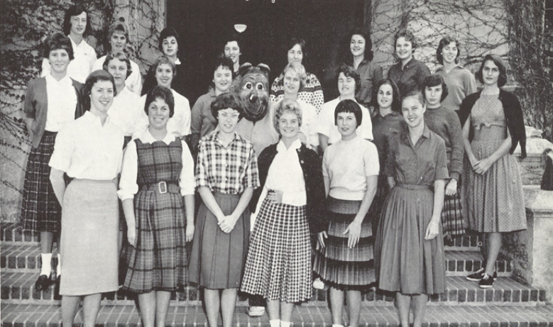 Archival scan: Oski among a large staff group posing outdoors. Photo credit: Photographer/artist uncredited in supplied scan.