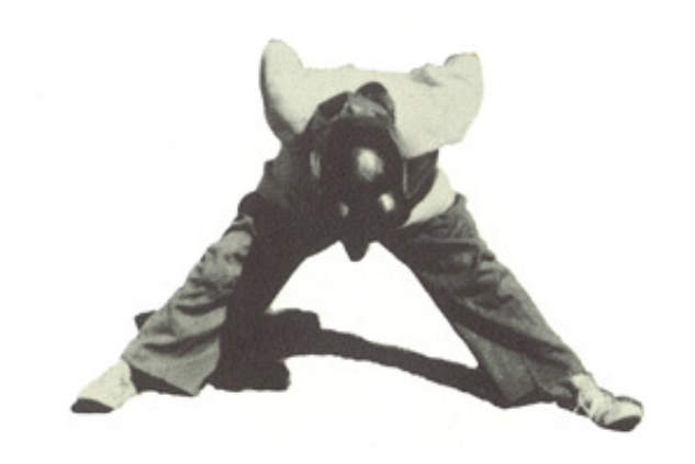 Archival scan: Oski bent forward in a wide-legged pose. Photo credit: Photographer/artist uncredited in supplied scan.