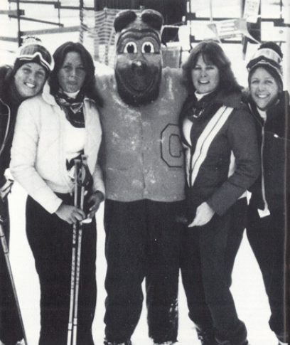 Archival scan: Oski posing with a ski team. Photo credit: Photographer/artist uncredited in supplied scan.